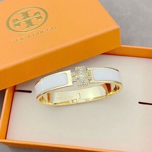 Tory Burch Gold-Tone Bangle with White Enamel and Crystal Logo
